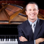 Michael Adcock with piano
